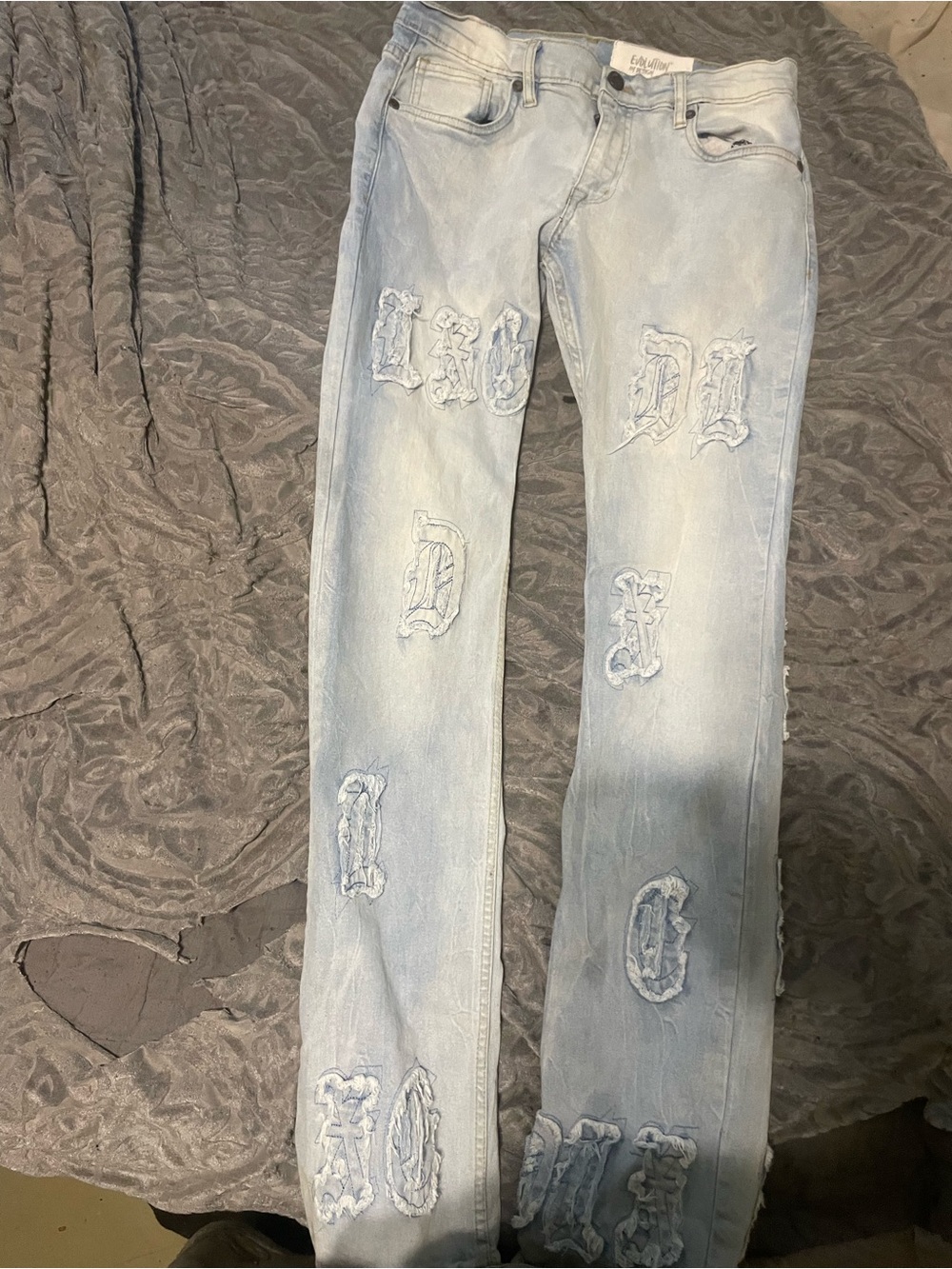 Light Blue Distressed Wide-Leg Jeans with Appliqué Lettering